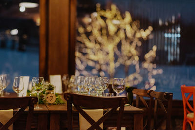 Empty chairs and tables in restaurant