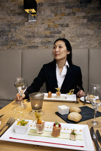 Businesswoman eating at restaurant in a luxury hotel