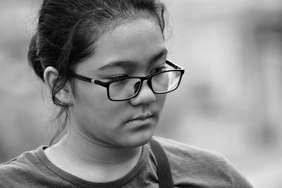 Close-up portrait of a girl wearing eyeglasses