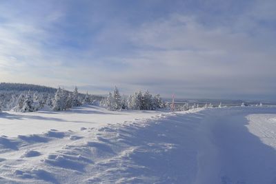 Scenic view of sea against cloudy sky