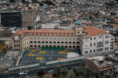 High angle view of buildings and cars in city