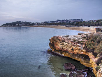 Scenic view of sea against cloudy sky