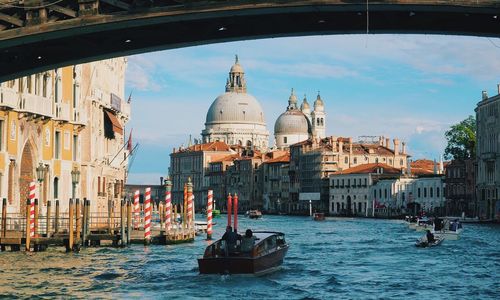 Boats in grand canal against santa maria della salute