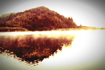 Scenic view of lake at sunset