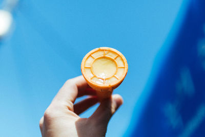 Close-up of hand holding coffee cup