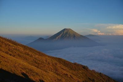 Mount sindoro seen from mount sumbing in morning where thick clouds still lay cover the view