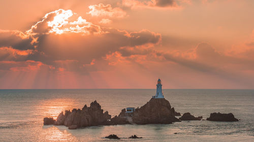 Scenic view of sea against sky at sunset