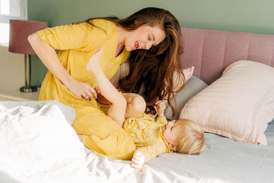 Young woman sleeping on bed at home