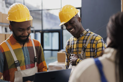 Rear view of man working at construction site