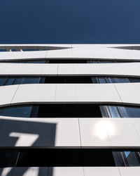 Low angle view of modern building against clear sky