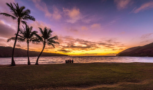 Scenic view of beach against sky during sunset