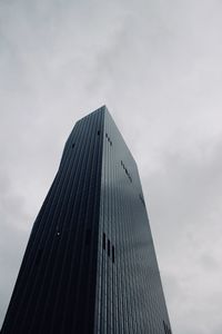 Low angle view of skyscraper against sky