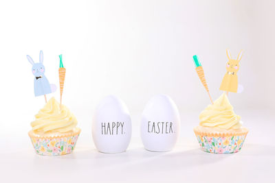 Close-up of cupcakes against white background