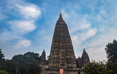 Mahabodhi temple buddhist stupas isolated with bright sky and unique prospective