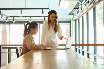 Colleagues working in office