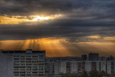 Cityscape against sky during sunset
