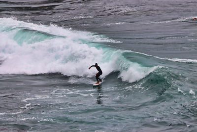 Person surfing in sea