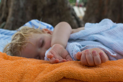 Close-up of baby sleeping outdoors