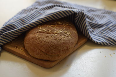 High angle view of bread on cutting board