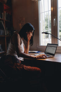 Mature freelancer using laptop at home