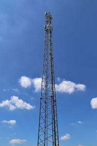 Low angle view of communications tower against sky