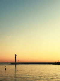 Scenic view of sea against clear sky during sunset