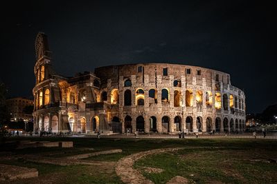 Low angle view of illuminated cathedral against sky at night