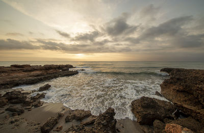 Scenic view of sea against sky during sunset