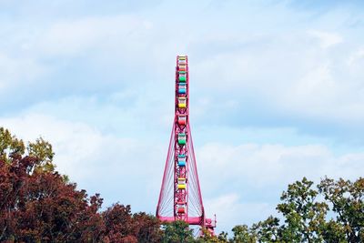 Low angle view of ferris wheel against sky