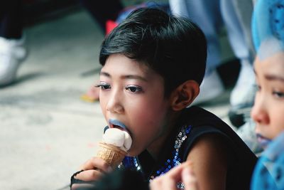 Portrait of boy holding ice cream