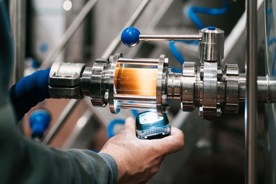 Close-up of man working at machine