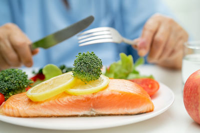 Midsection of man holding food