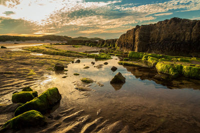 Scenic view of landscape against sky at sunset