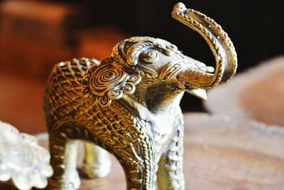 Close-up of brass elephant souvenir statue