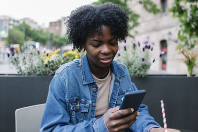 Mid adult man using mobile phone