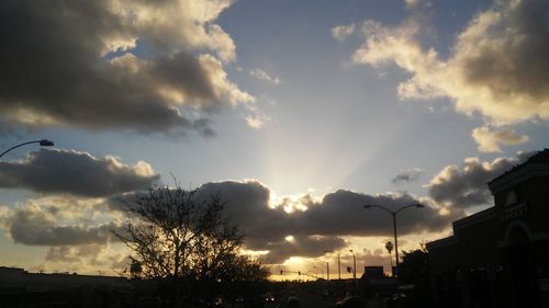 Low angle view of buildings against sky during sunset