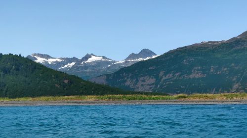 Scenic view of mountains against clear blue sky