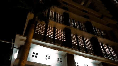 Low angle view of illuminated building at night