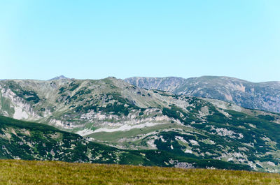 Scenic view of mountains against clear sky