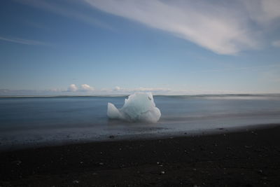 Scenic view of sea against sky during winter