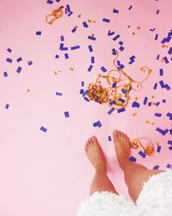 Low section of woman standing on tiled floor