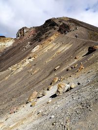 Rock formations on landscape against sky