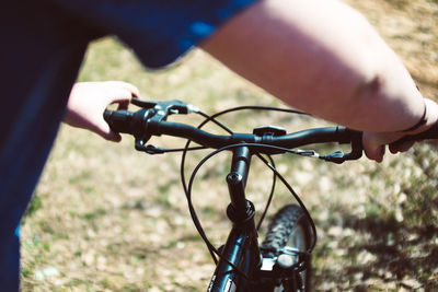 Midsection of person riding bicycle