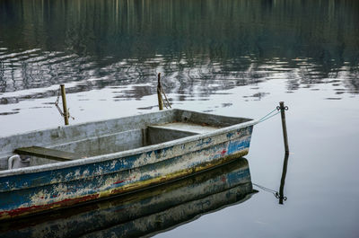 Boat moored in lake