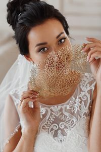 Close-up portrait of a young woman holding ice cream