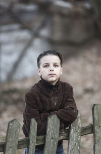 Portrait of boy standing on field