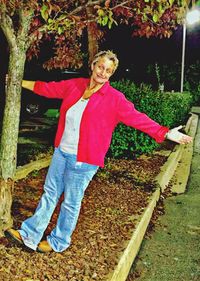 Portrait of smiling woman standing outdoors