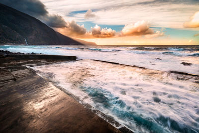 Scenic view of sea against sky during sunset