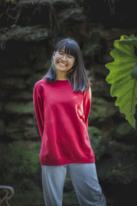 Portrait of asian teenager wearing eyeglasses standing outdoor