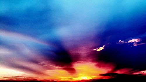 Low angle view of dramatic sky during sunset